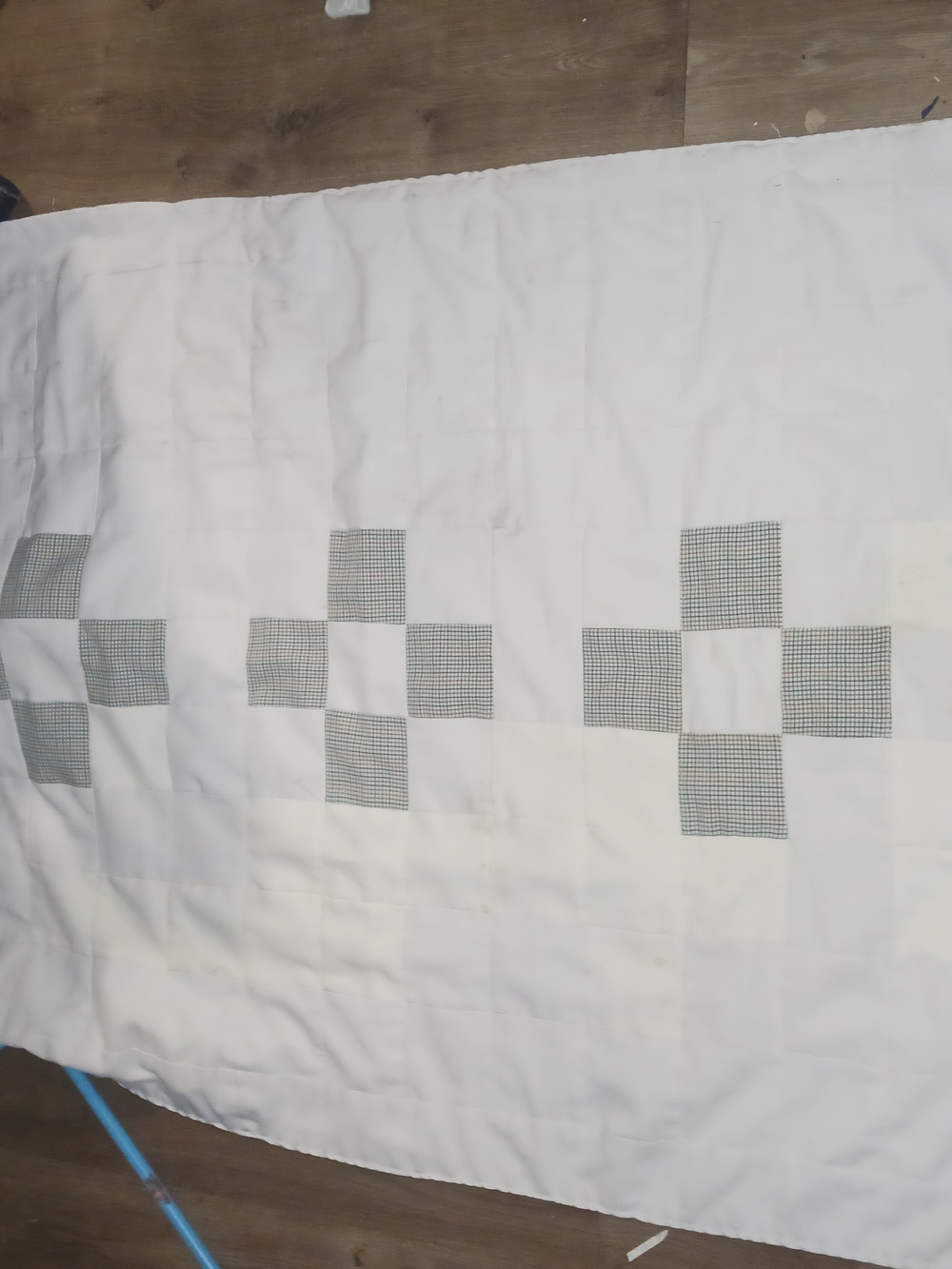 White Patchwork Quilt with Gray Check Accents